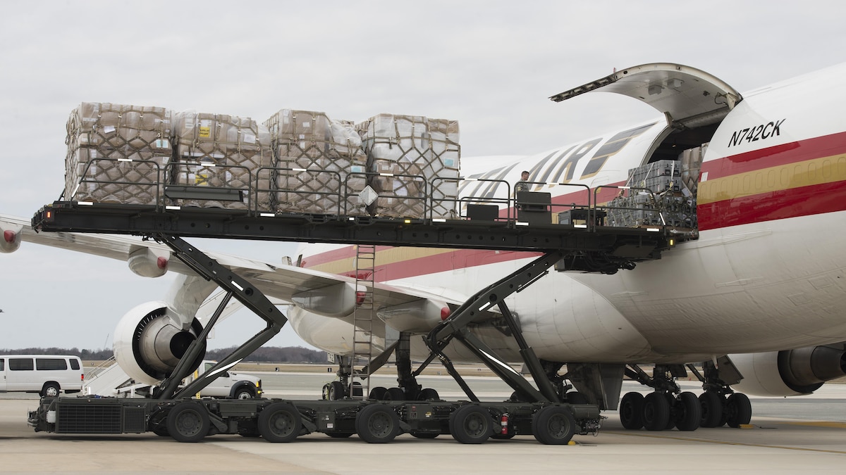 Cargo airplane being loaded at airport